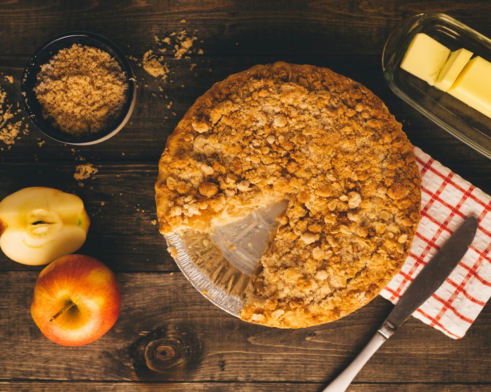 Crumb-topped pie, one slice cut