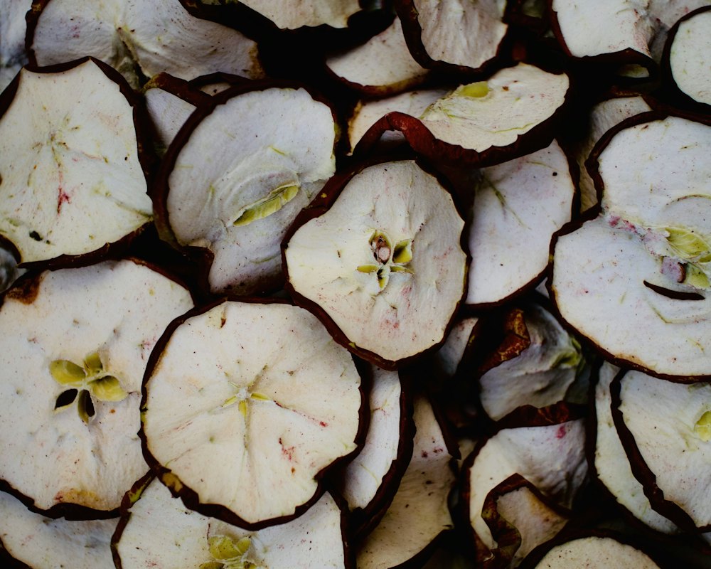 Dried apple rings spilling from a paper bag