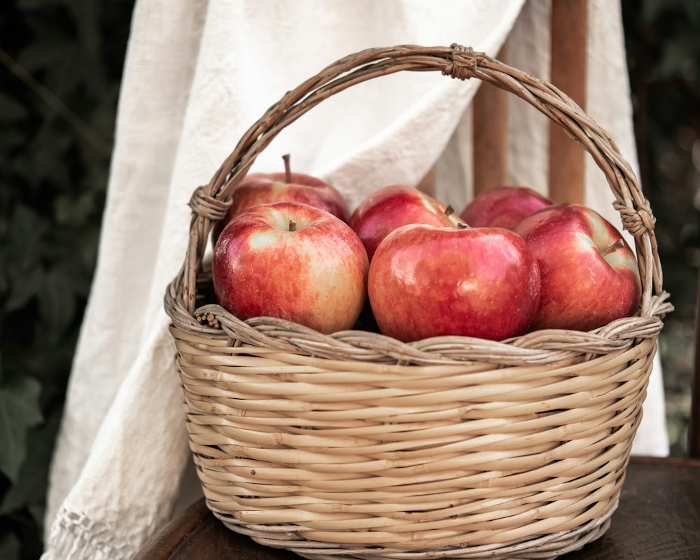 McIntosh apples in a wooden half-peck basket, morning light